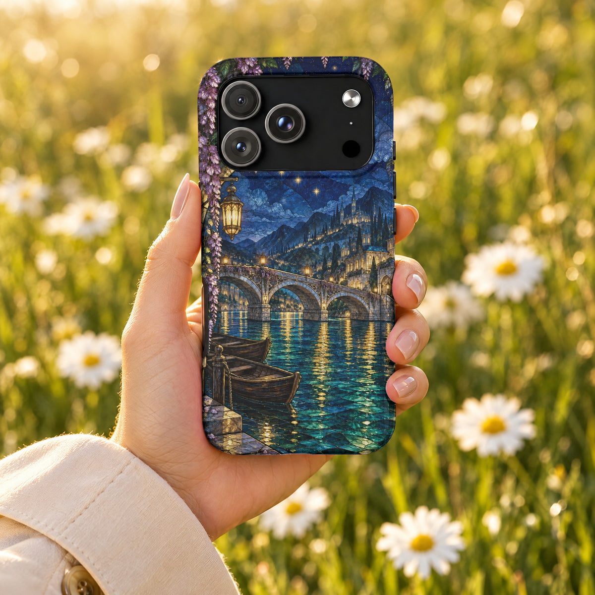 A hand holds a smartphone featuring a fantasy landscape case against a blurred daisy meadow background.