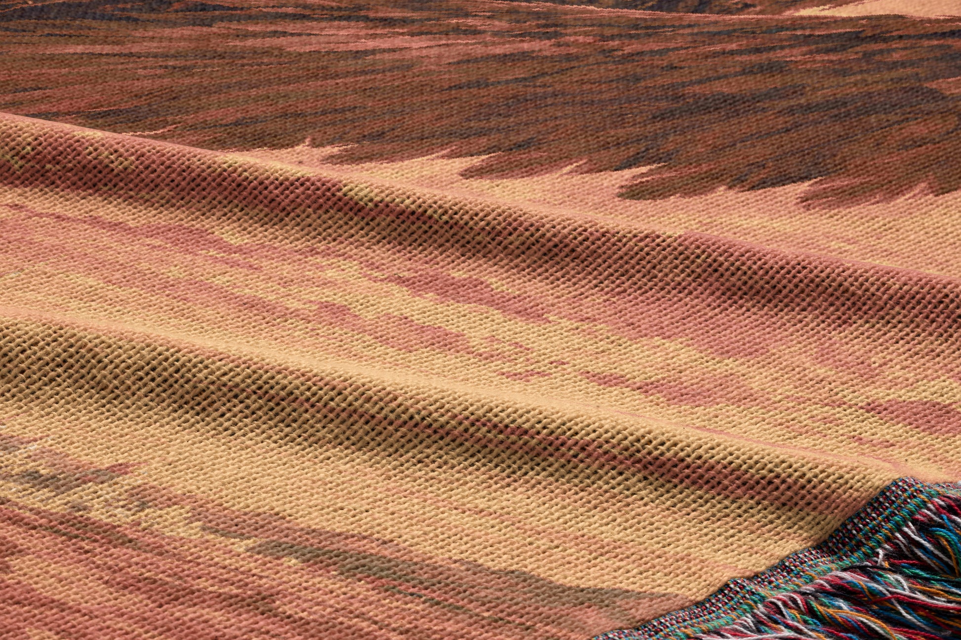 a close-up view of a woven fabric with a textured pattern, featuring a mix of warm colors such as brown, orange, and beige.