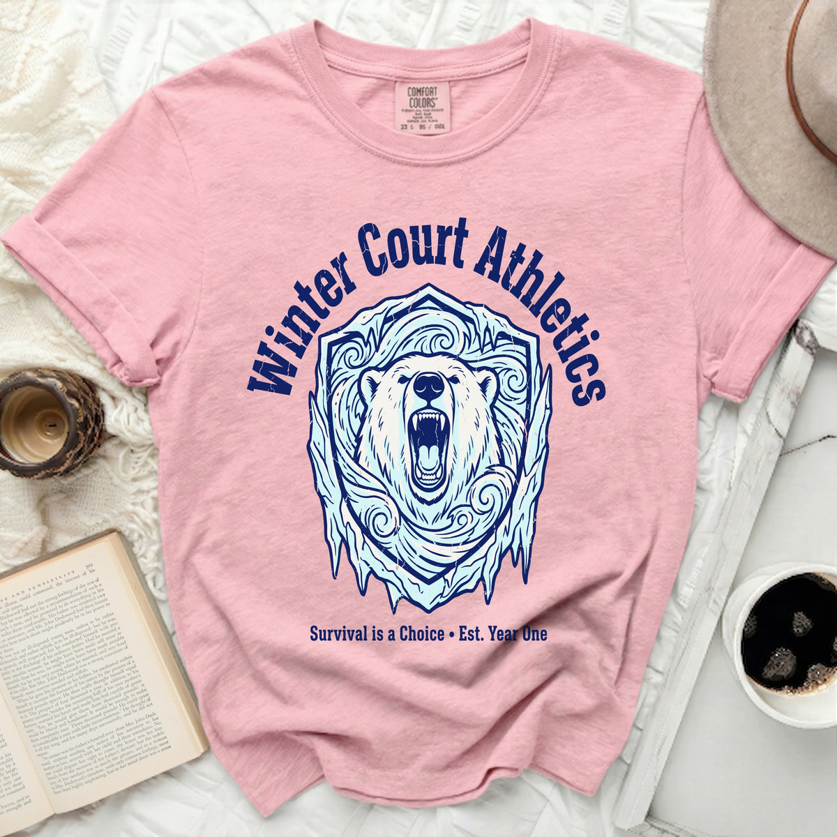 Pink shirt with "Winter Court Athletics" text and a polar bear in an ice shield design.