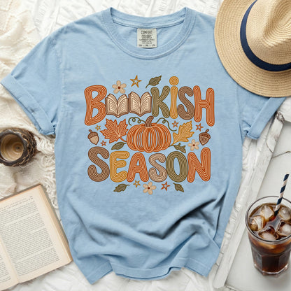 Light blue t-shirt with "Bookish Season" text, pumpkin, and autumn leaves graphic.