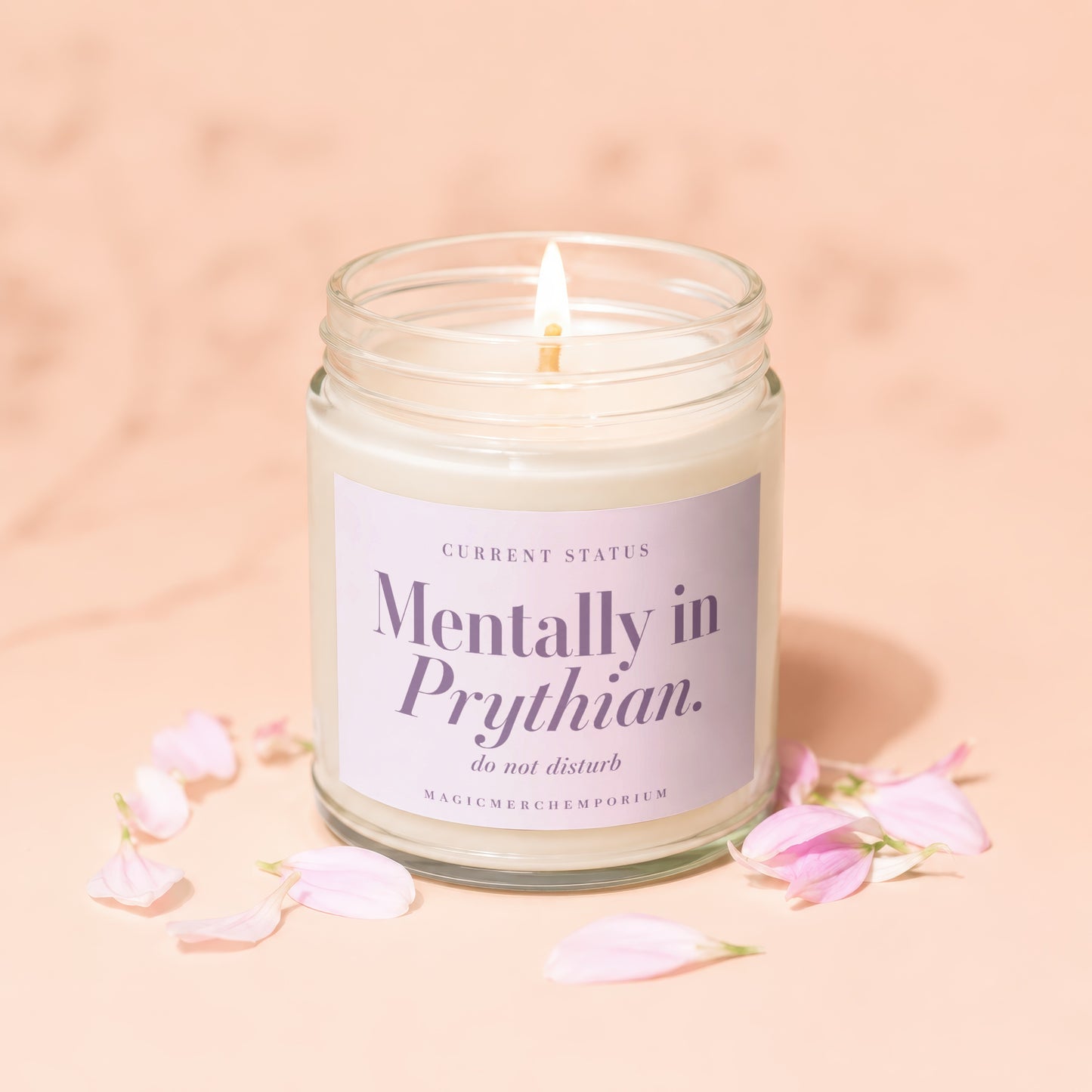 Candle with label "Mentally in Prythian. do not disturb" surrounded by pink petals.