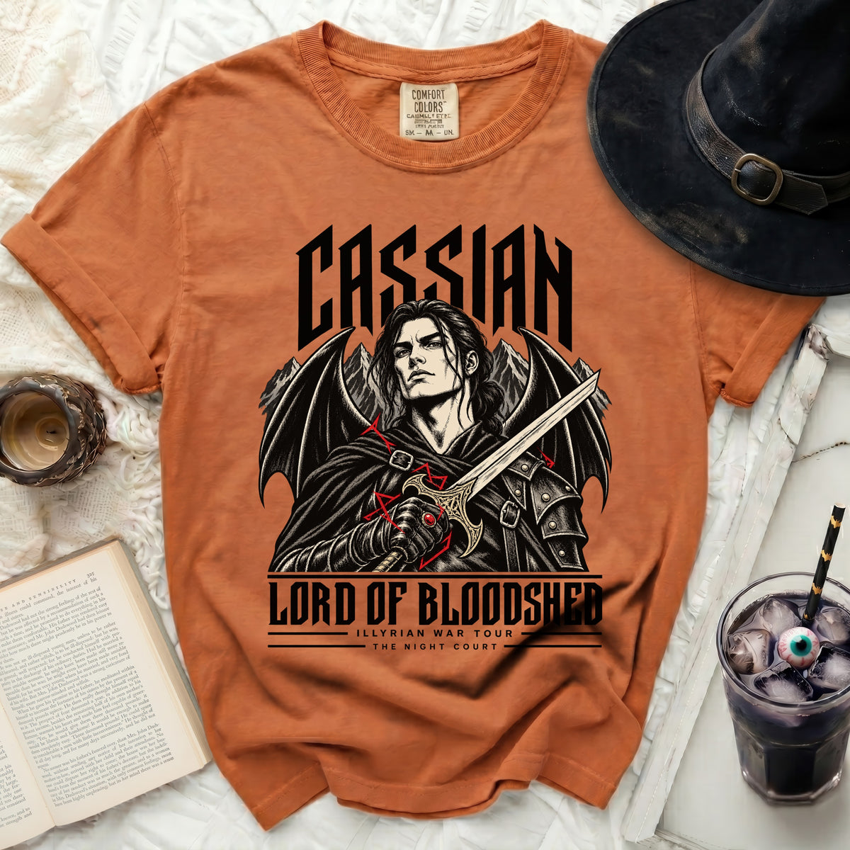 Orange t-shirt with Cassian "Lord of Bloodshed" graphic and winged figure holding sword.