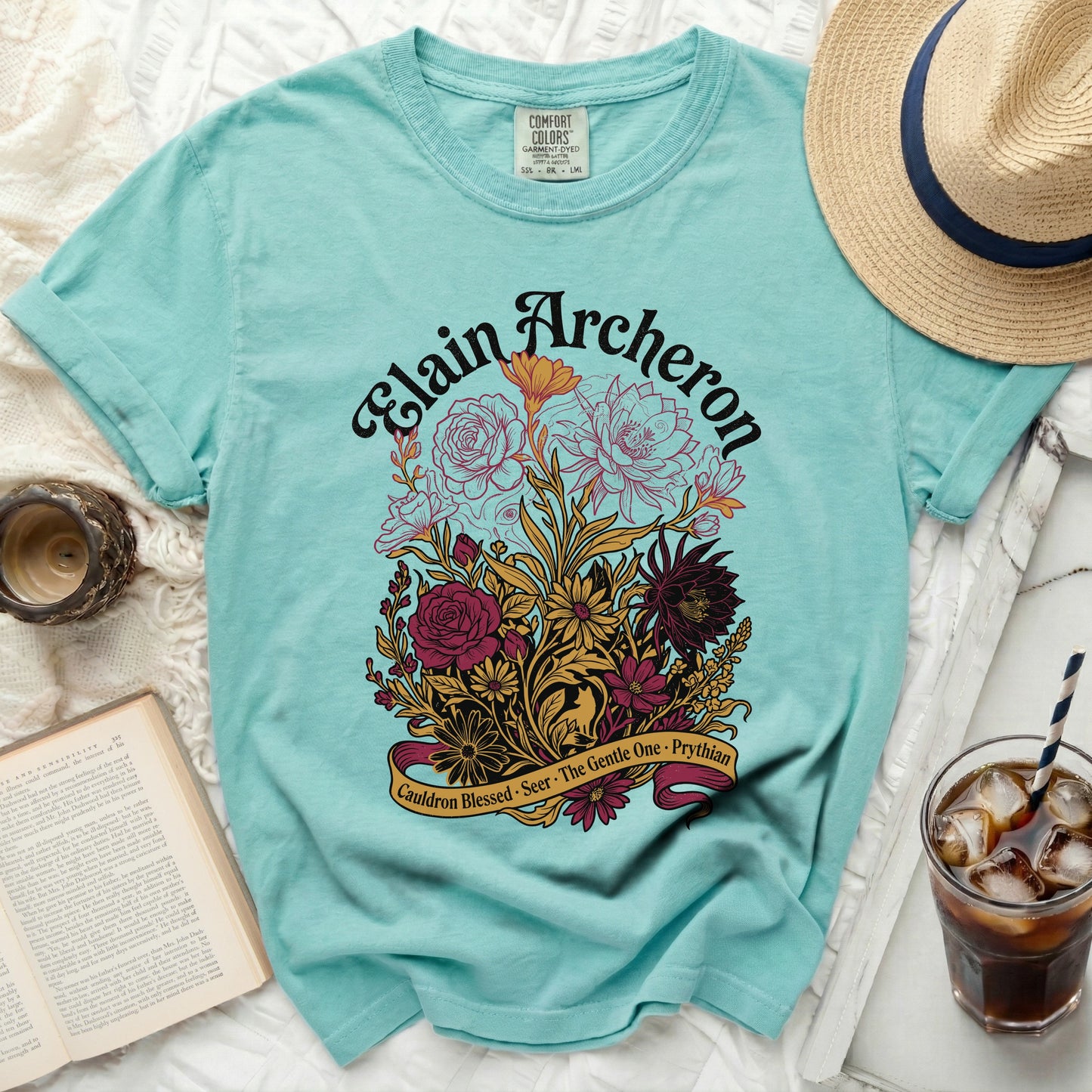 Teal t-shirt with "Elain Archeron" and floral design.