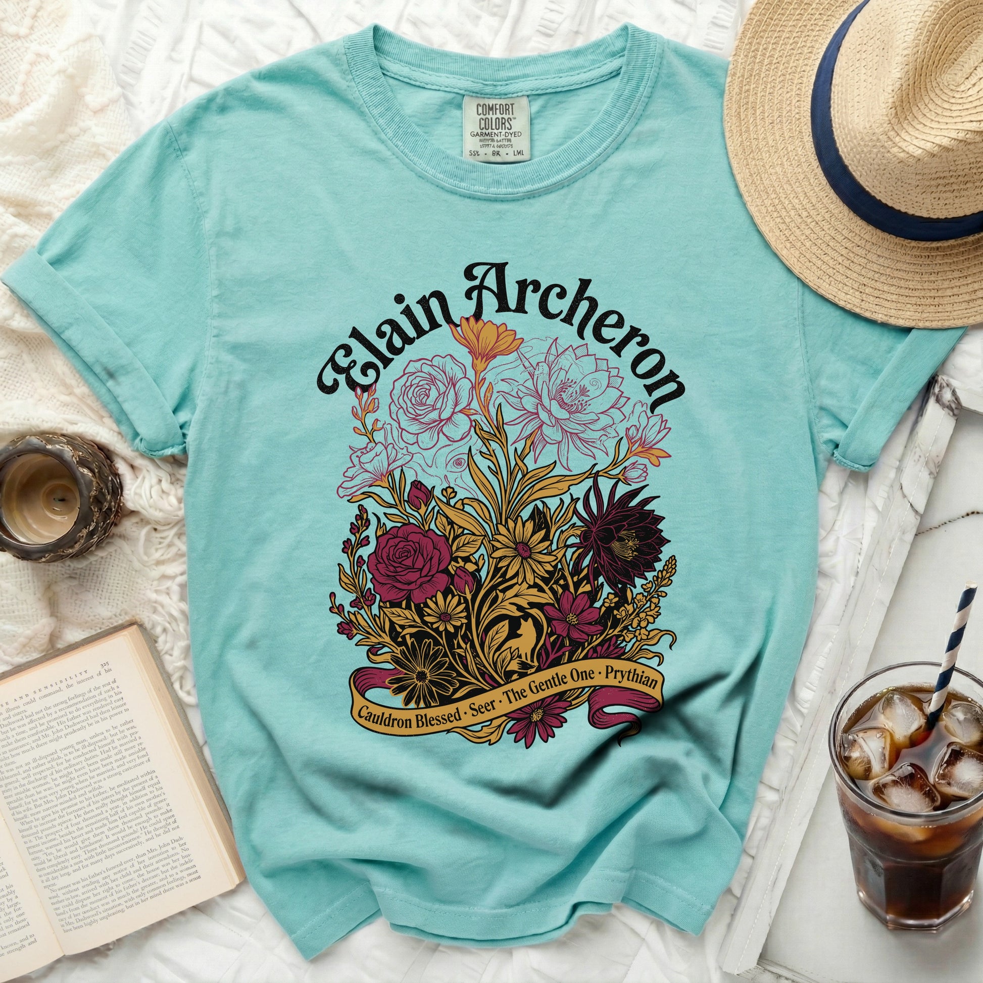 Teal t-shirt with "Elain Archeron" and floral design.