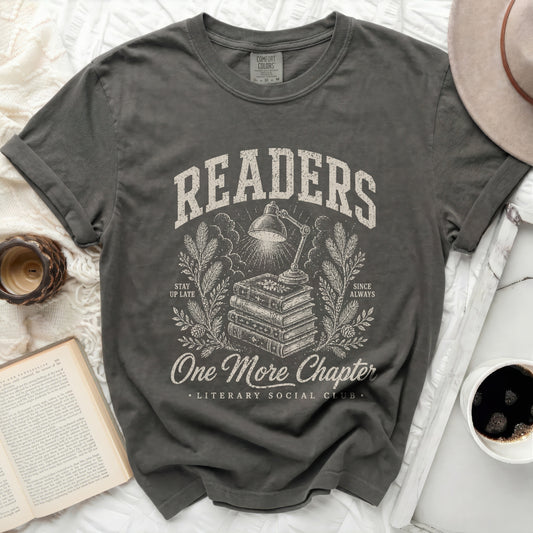 Graphic t-shirt with "Readers One More Chapter" text and stacked books.