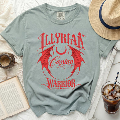 Light blue t-shirt with red "ILLYRIAN Cassian WARRIOR" text and dragon wings.