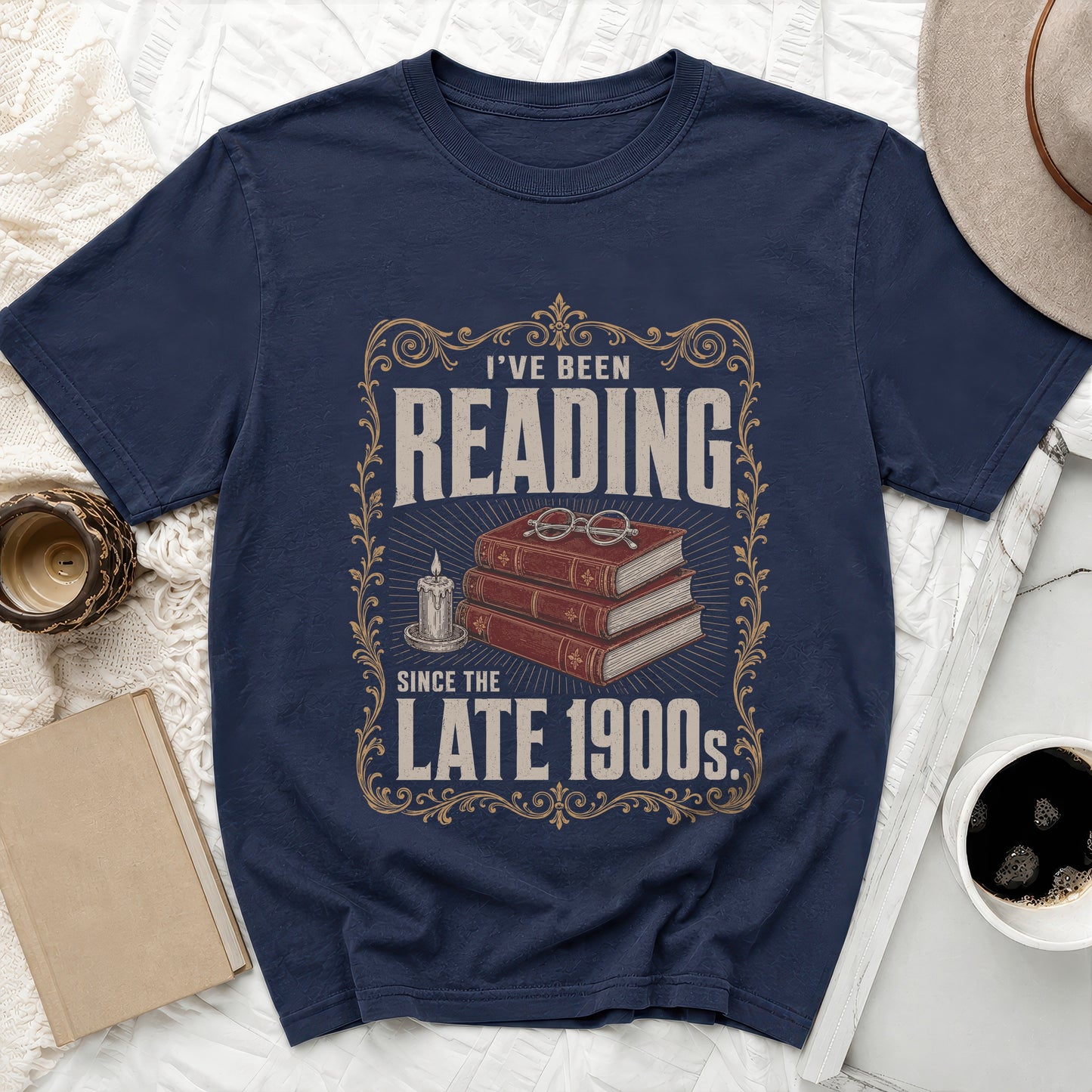 Navy t-shirt with "I've Been Reading Since the Late 1900s" text and vintage graphics.