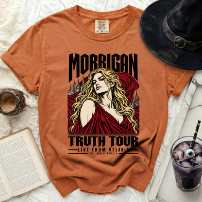 Orange t-shirt with "Morrigan Truth Tour Live From Velaris The Inner Circle" graphic.