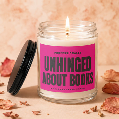 Lit candle in glass jar with hot pink label reading "Professionally Unhinged About Books".