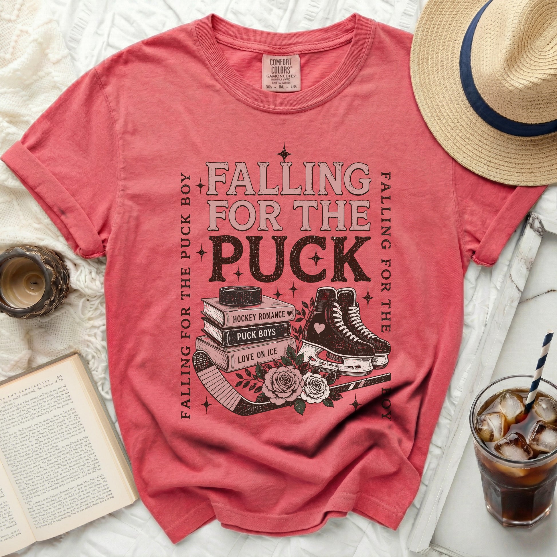 Pink t-shirt with "Falling for the Puck Boy" text and hockey skates.