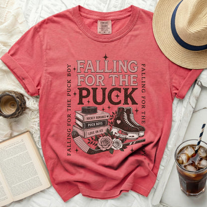 Pink t-shirt with "Falling for the Puck Boy" text and hockey skates.
