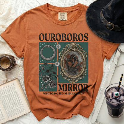 Orange t-shirt with Ouroboros and mirror graphic, text "OUROBOROS MIRROR WHAT DO YOU SEE NESTA ARCHERON".