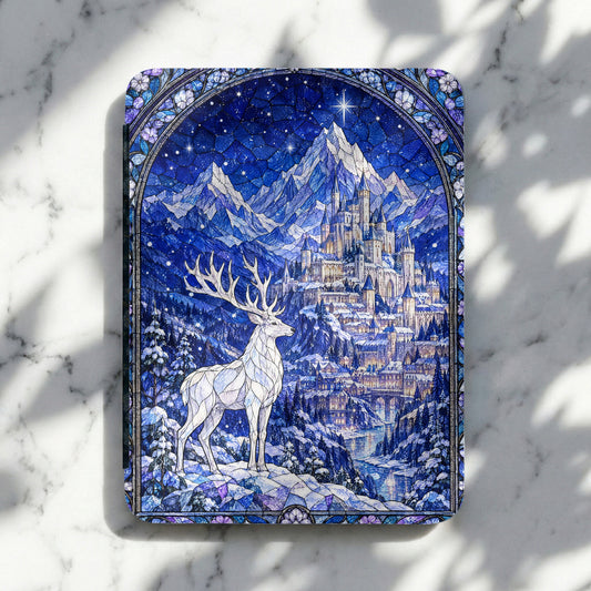 E-reader case featuring a blue-toned stained glass illustration of a white stag, snow-covered mountains, and a castle.