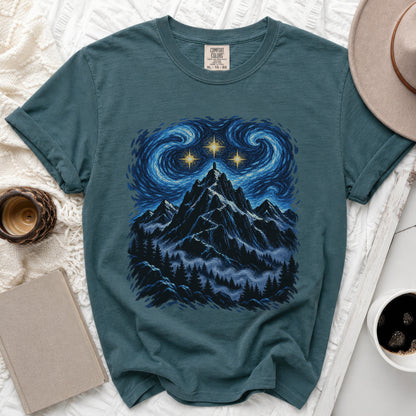 Teal t-shirt with mountain and starry sky graphic, size XL.