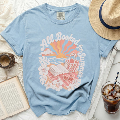 Blue t-shirt with "All Booked for Summer" graphic and open book.