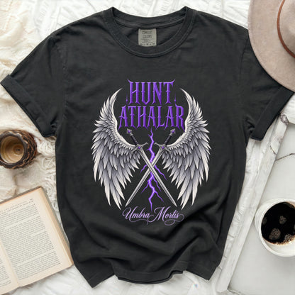 Black t-shirt with "Hunt Athalar Umbra Mortis" text, winged swords, and purple lightning.