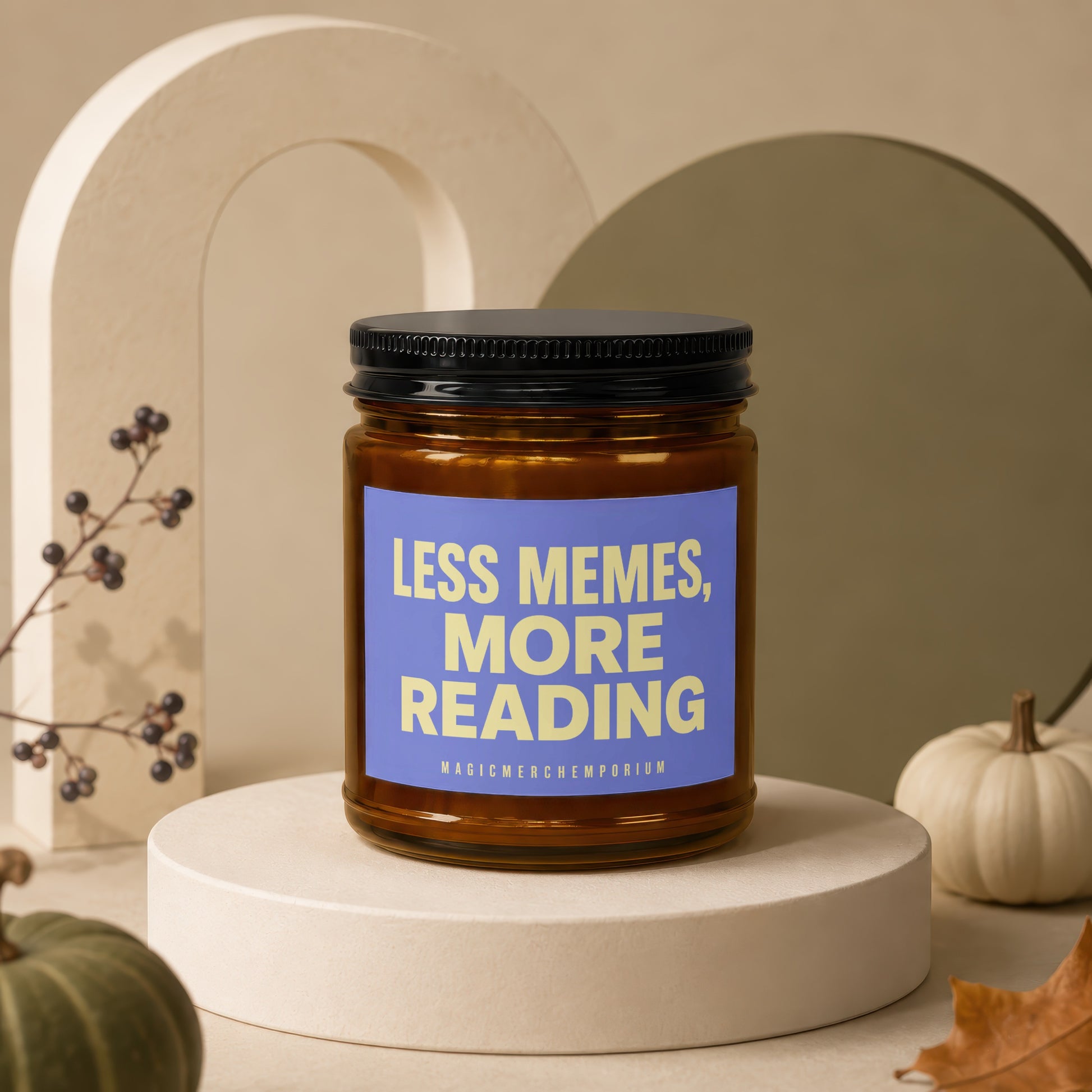 Amber jar candle with blue label reading "Less Memes, More Reading" and "Magic Merch Emporium."