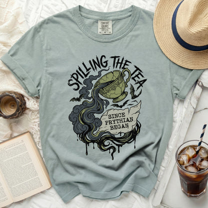 T-shirt with "Spilling the Tea Since Phythian Began" text and a cracked teacup.