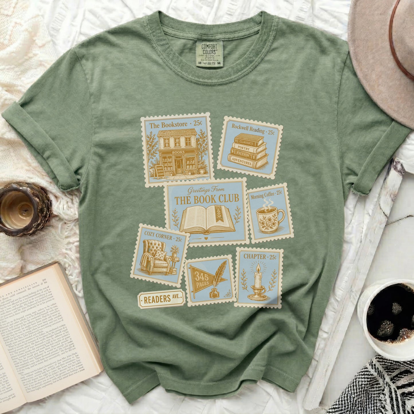 Olive green t-shirt with vintage postcard graphics of books and coffee.