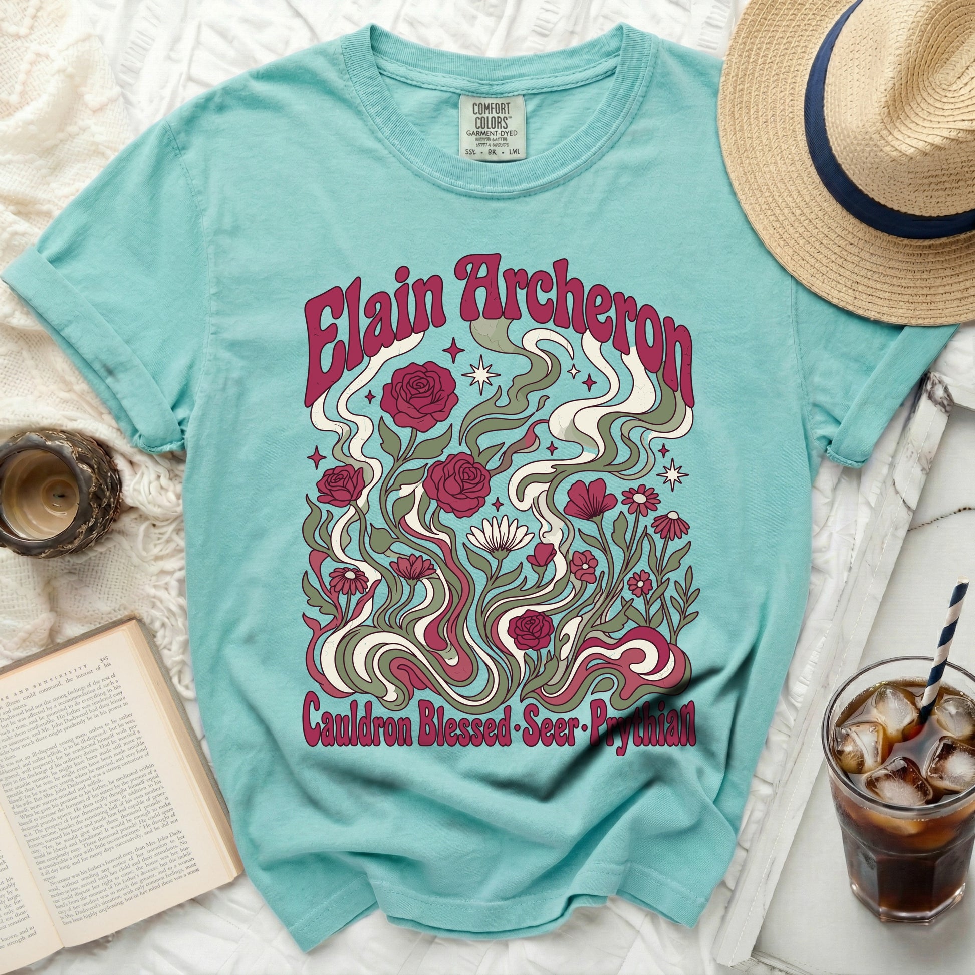 Teal t-shirt with "Elain Archeron Cauldron Blessed Seer Prythian" floral design.