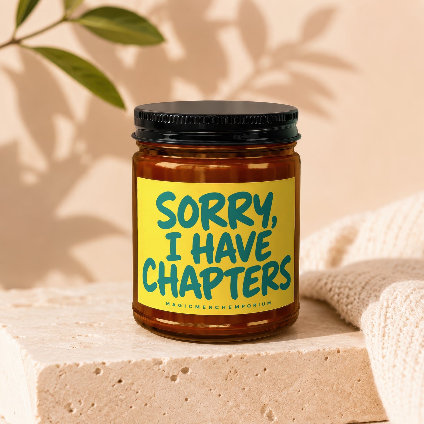 Candle with a yellow label stating "SORRY, I HAVE CHAPTERS".