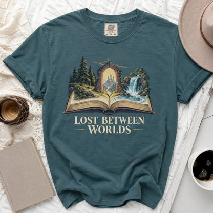 Teal t-shirt with open book graphic showing a castle through an archway.