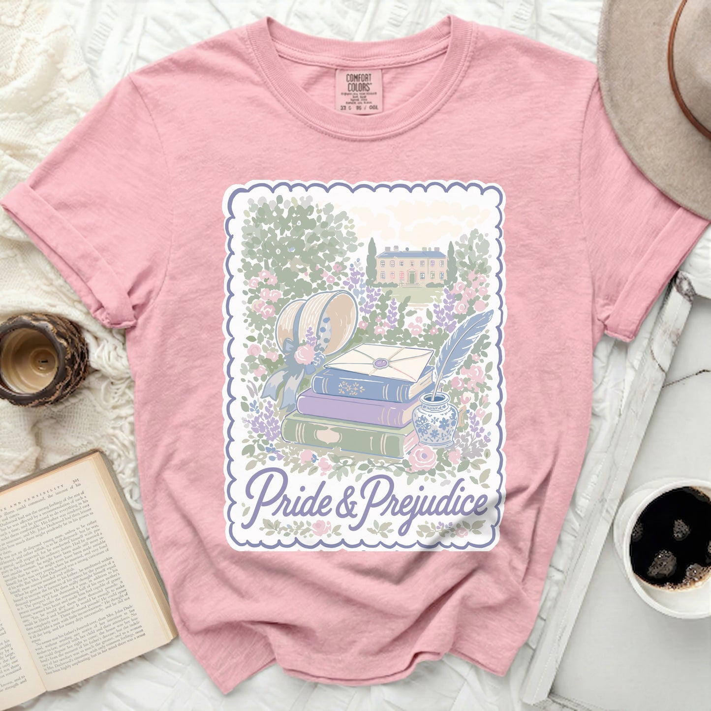 Pink Comfort Colors t-shirt with "Pride & Prejudice" and garden illustration.
