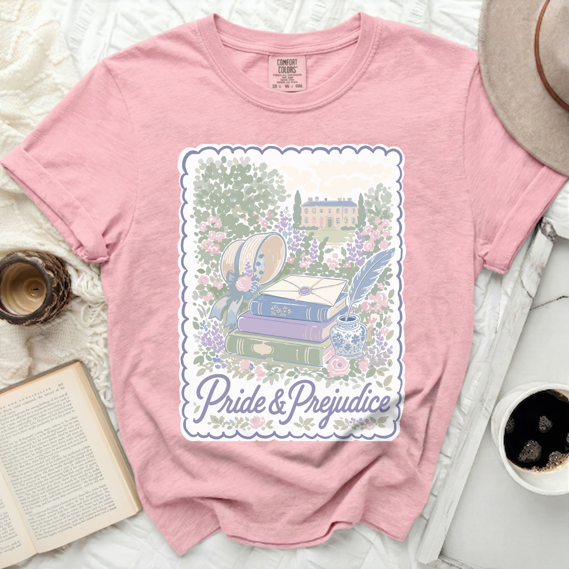 Pink Comfort Colors t-shirt with "Pride & Prejudice" and garden illustration.