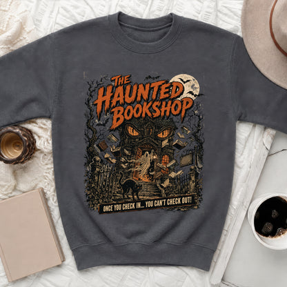 Dark sweatshirt with haunted bookshop graphic and text that reads "ONCE YOU CHECK IN... YOU CAN'T CHECK OUT!"