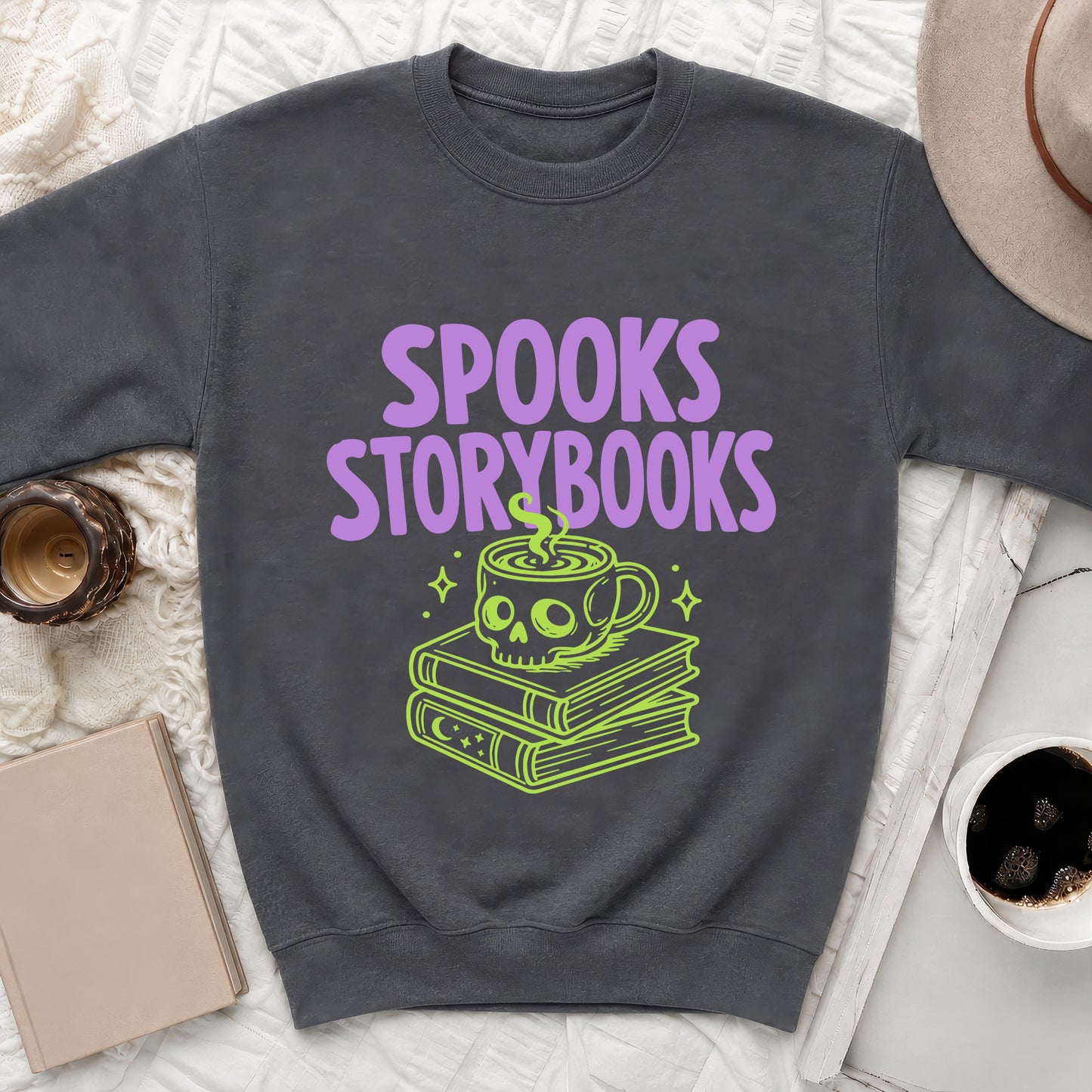 Dark grey sweatshirt with "SPOOKS STORYBOOKS" text and a skull coffee cup on books graphic.