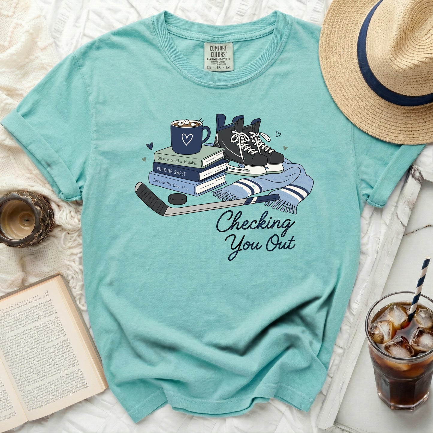 T-shirt with hockey skates, puck, stick, and mug with "Checking You Out" text.