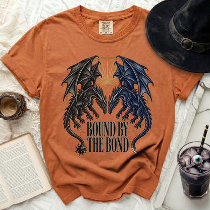 Orange t-shirt with black and blue dragons and text "BOUND BY THE BOND".