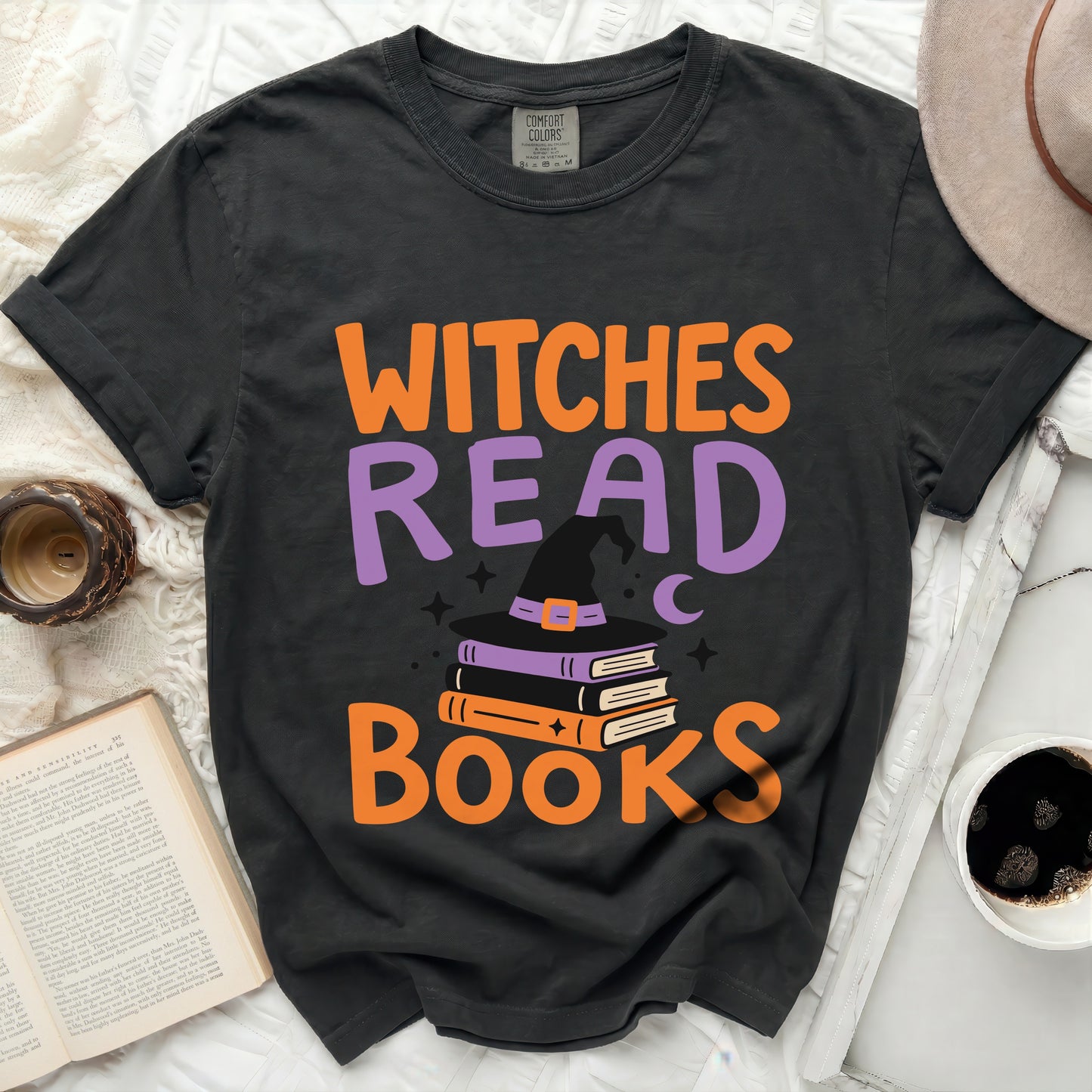 Black t-shirt with "Witches Read Books" and witch hat graphic.