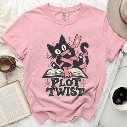 Black cat tangled in ribbon on open book with "Plot Twist" text.