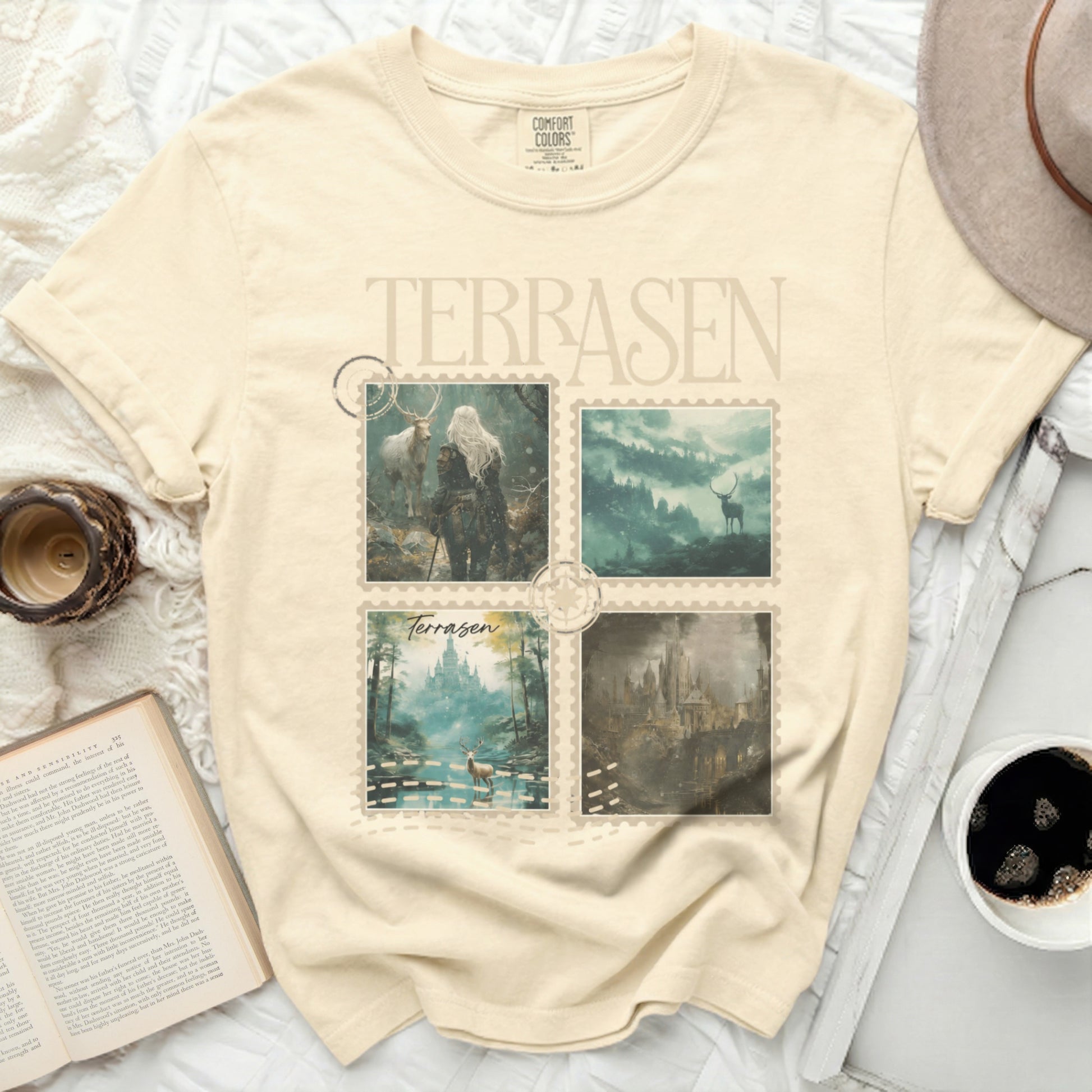Comfort Colors t-shirt with four fantasy landscape vignettes and "Terrasen" text.