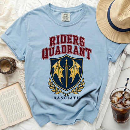 Light blue t-shirt with "Riders Quadrant" and a shield with sword and wings.