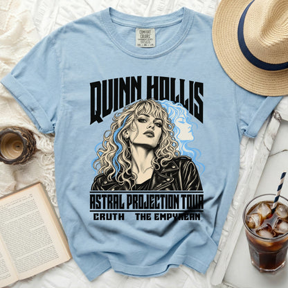 Light blue t-shirt with "QUINN HOLLIS ASTRAL PROJECTION TOUR" text and illustration.