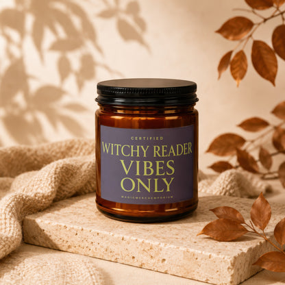 Amber jar candle with black lid labeled "Witchy Reader Vibes Only".