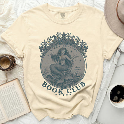Cream t-shirt with a mermaid reading a book, text "Siren Romance Book Club".