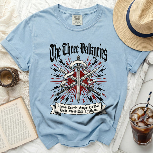 Light blue t-shirt with "The Three Valkyries" graphic and sword design.
