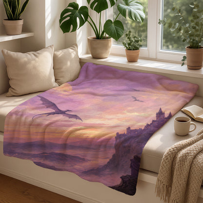 Purple blanket with dragons flying over castle ruins at sunset.