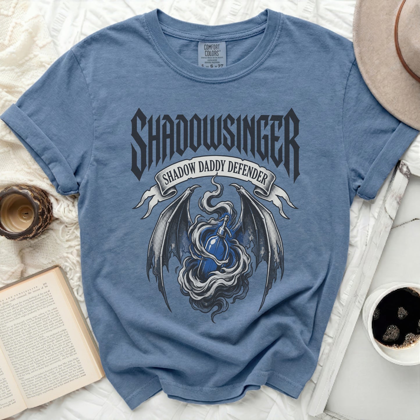 Blue t-shirt with "Shadowsinger Shadow Daddy Defender" gothic graphic.