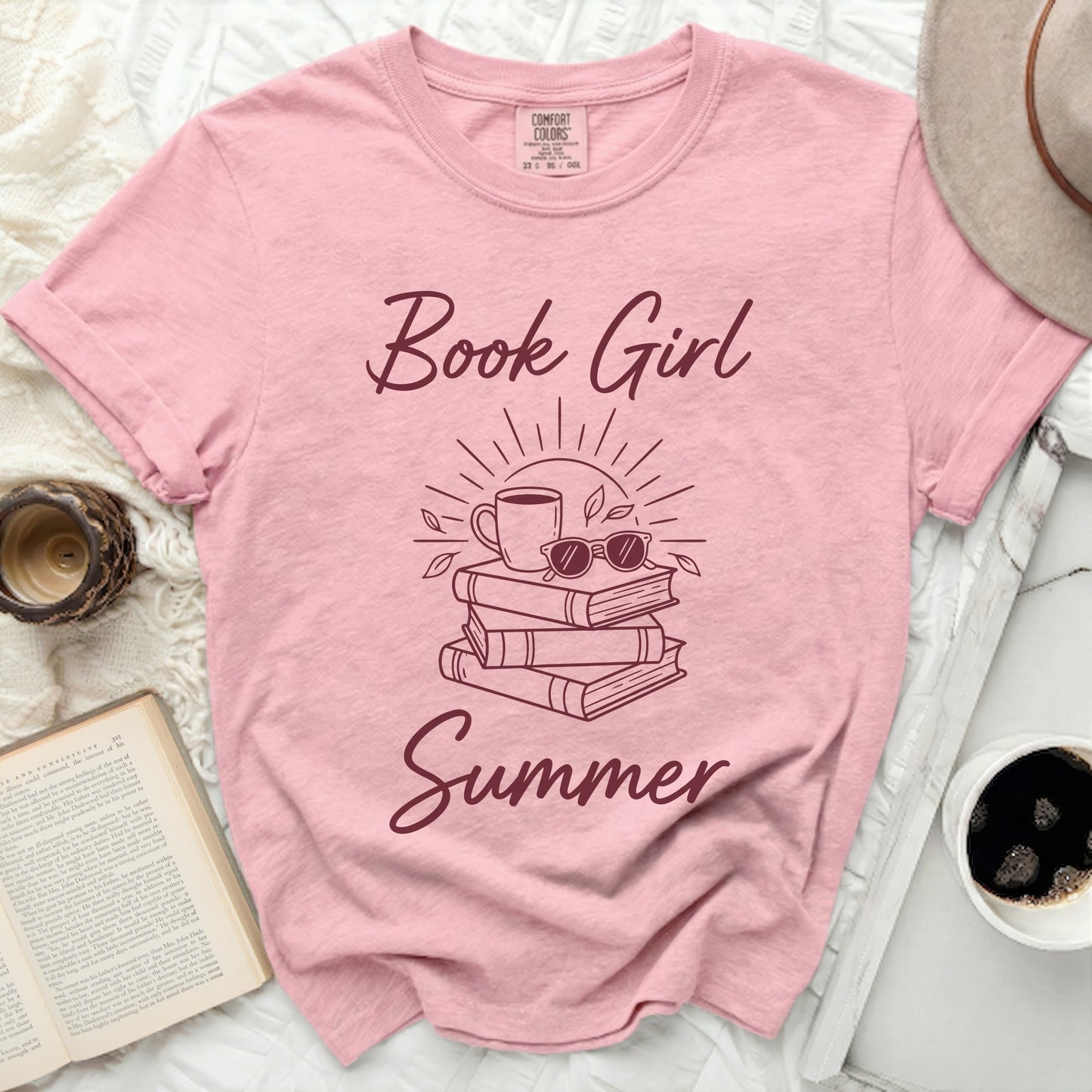Pink t-shirt with "Book Girl Summer" text and stacked books graphic.