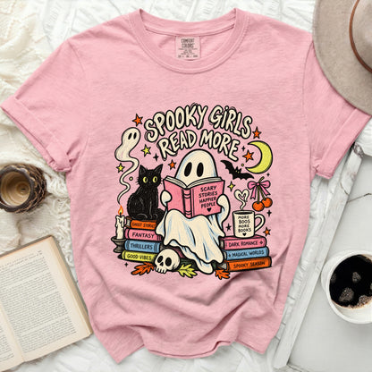 Pink t-shirt with spooky girls read more graphic featuring ghosts, cat, and books.