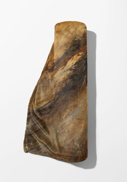 Rolled textile with abstract brown, blue, and tan watercolor-style print.