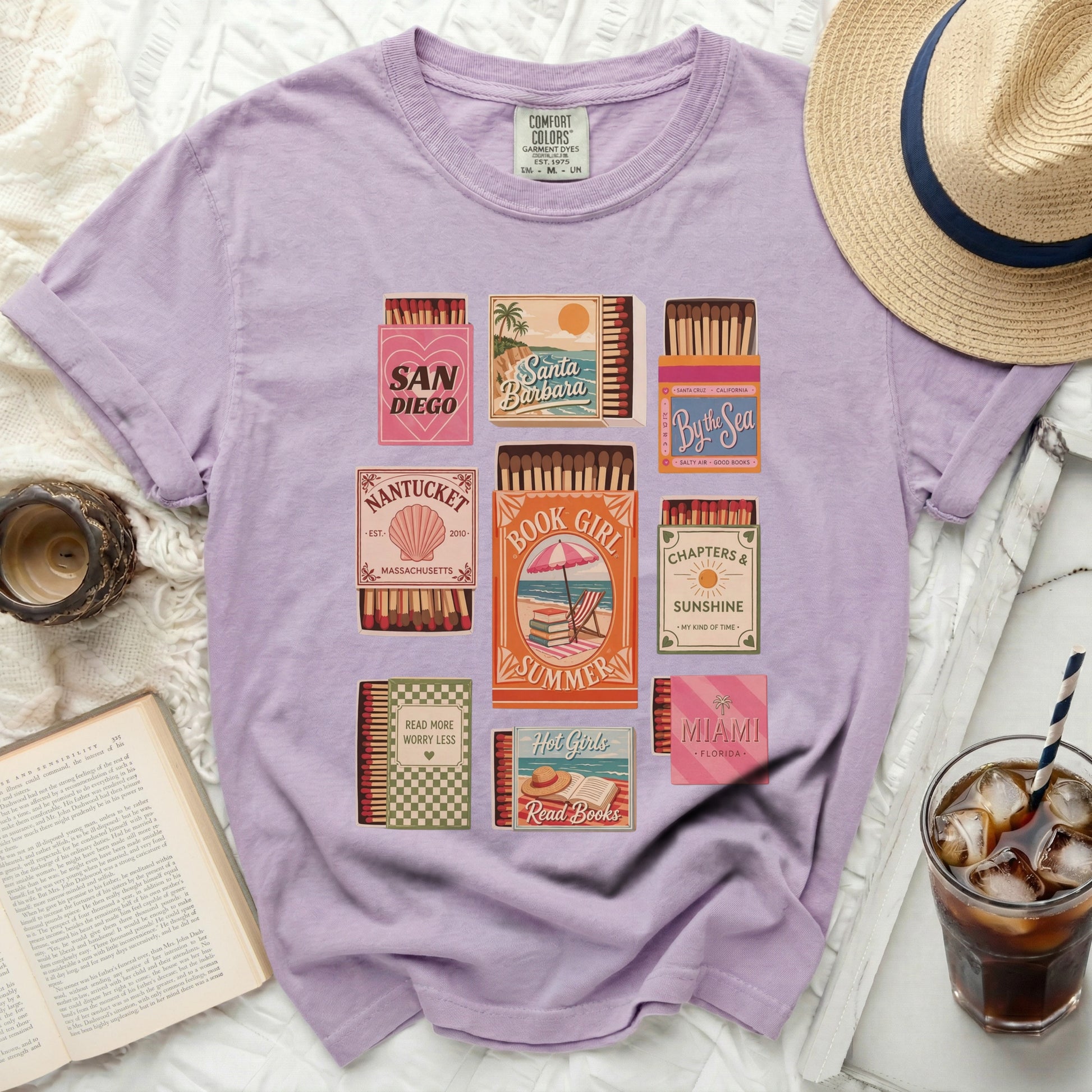 T-shirt with colorful matchbox designs featuring book and travel themes.