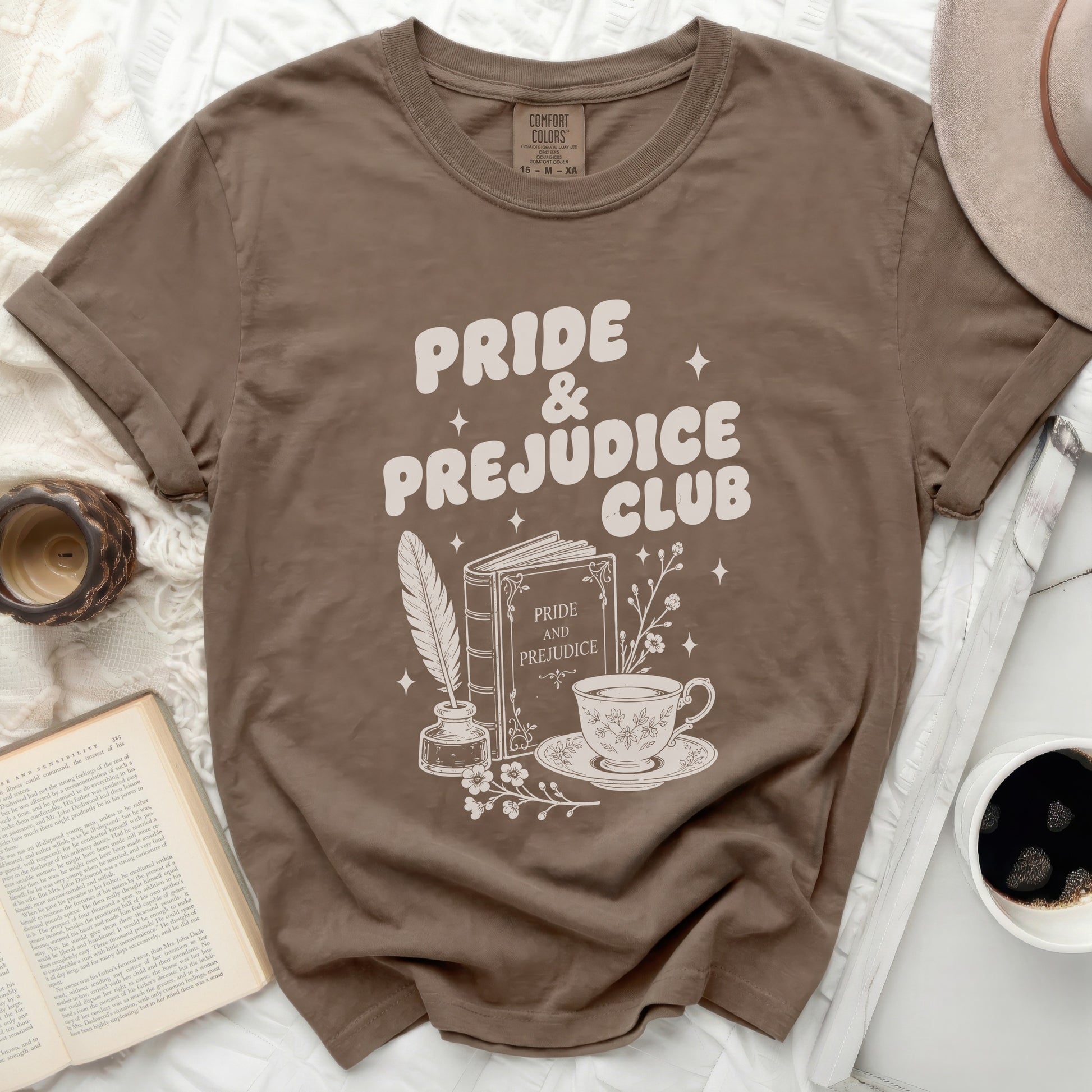 Brown t-shirt with Pride & Prejudice Club graphic design.