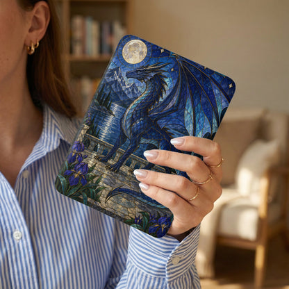 Blue stained glass dragon with moon, mountains, and irises on a case held by a woman.