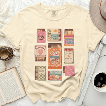 T-shirt with vintage-style book and travel themed graphic art.
