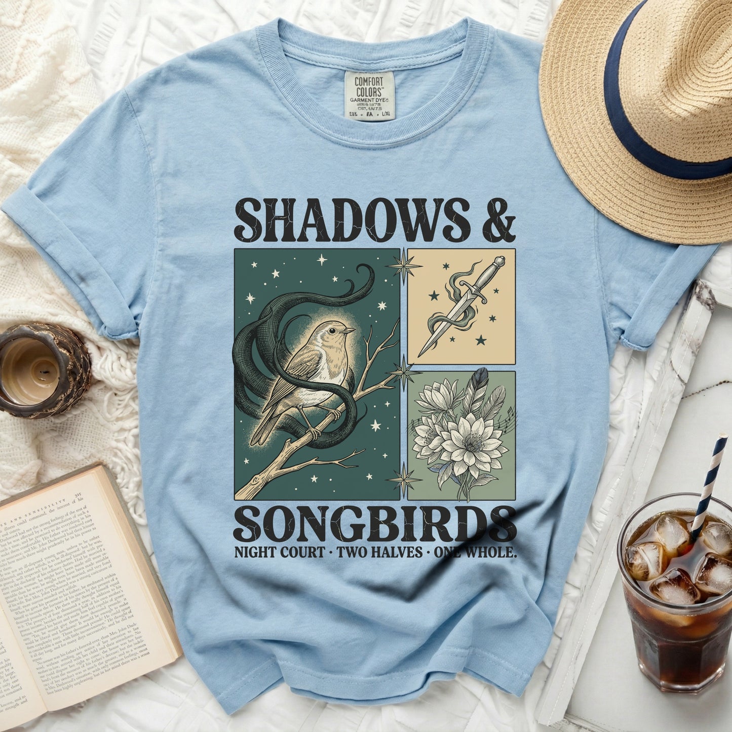 Light blue t-shirt with "Shadows & Songbirds" graphic and text.